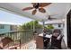 Enjoy great views from this screened in balcony with ceiling fans and table and chair seating at 3703 5Th Ave # 3, Holmes Beach, FL 34217