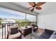 Screened balcony with ceiling fan and relaxing furniture at 3703 5Th Ave # 3, Holmes Beach, FL 34217