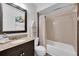 Bathroom with granite vanity and shower over tub at 3703 5Th Ave # 3, Holmes Beach, FL 34217