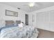 Comfortable bedroom with white furniture, plenty of closet space, and natural light at 3703 5Th Ave # 3, Holmes Beach, FL 34217