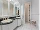 Bathroom with granite counters, and sinks and tiled floor at 3800 Gulf Blvd # Ph, St Petersburg, FL 33706