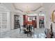 Bright dining area with chandelier, connecting to kitchen with seating, ideal for entertaining at 3800 Gulf Blvd # Ph, St Petersburg, FL 33706