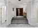 Welcoming foyer with marble floors, double doors, and elegant architectural details at 3800 Gulf Blvd # Ph, St Petersburg, FL 33706