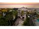 Stunning beachfront home featuring a multi-story design with palm trees and ocean views at 3800 Gulf Blvd # Ph, St Petersburg, FL 33706