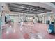A huge garage provides ample space for parking and storage with multiple work benches and shelving at 3800 Gulf Blvd # Ph, St Petersburg, FL 33706