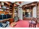 Traditional home office with custom built-in bookshelves, wood trim, and a desk area for a dual monitor computer set up at 3800 Gulf Blvd # Ph, St Petersburg, FL 33706