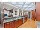 Gourmet kitchen featuring custom cabinetry, granite countertops, and stainless steel appliances at 3800 Gulf Blvd # Ph, St Petersburg, FL 33706