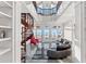 Grand living room with a spiral staircase and breathtaking ocean views at 3800 Gulf Blvd # Ph, St Petersburg, FL 33706