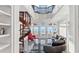 Living room with spiral staircase, ocean views, and luxurious seating at 3800 Gulf Blvd # Ph, St Petersburg, FL 33706