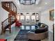 Elegant living room features a spiral staircase, ocean views, and upscale furnishings at 3800 Gulf Blvd # Ph, St Petersburg, FL 33706