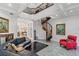 Inviting living room with spiral staircase, elegant furnishings, and access to other areas at 3800 Gulf Blvd # Ph, St Petersburg, FL 33706