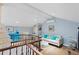 Bright living room with a cozy sofa, hardwood floors, and a stylish chandelier, offering a comfortable and relaxing atmosphere at 3800 Gulf Blvd # Ph, St Petersburg, FL 33706