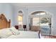 Main bedroom featuring hardwood floors, large windows offering ocean views, and a comfortable seating area by the windows at 3800 Gulf Blvd # Ph, St Petersburg, FL 33706
