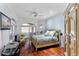 Serene bedroom with hardwood floors, ocean views, and a sitting area at 3800 Gulf Blvd # Ph, St Petersburg, FL 33706