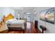 Bright main bedroom features hardwood floors, large windows with stunning ocean views, and a flat screen television at 3800 Gulf Blvd # Ph, St Petersburg, FL 33706
