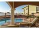 Inviting outdoor pool and lounge area with brick pavers and shaded seating, perfect for relaxation and entertaining guests at 3800 Gulf Blvd # Ph, St Petersburg, FL 33706