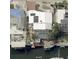 Aerial view of a house highlighting a private boat dock, swimming pool and canal access at 409 Bryn Mawr Is, Bradenton, FL 34207