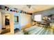 Bedroom features a closet with toys on top and doorway to additional space at 409 Bryn Mawr Is, Bradenton, FL 34207