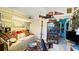 Cozy bedroom featuring eclectic decor, vintage furniture, and ample natural light at 409 Bryn Mawr Is, Bradenton, FL 34207