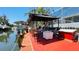 Waterfront dock featuring outdoor seating, perfect for enjoying the beautiful views and waterfront living at 409 Bryn Mawr Is, Bradenton, FL 34207