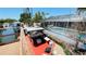 Scenic rooftop view of a waterfront dock, gazebo and pool area, ideal for outdoor entertaining at 409 Bryn Mawr Is, Bradenton, FL 34207