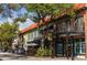 Charming street view with brick buildings, outdoor dining, and vibrant storefronts in a walkable neighborhood at 409 Bryn Mawr Is, Bradenton, FL 34207