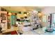 Open kitchen with modern bar seating and seamless flow into the dining area at 409 Bryn Mawr Is, Bradenton, FL 34207