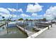 A marina featuring a modern sailboat docked with scenic waterfront views and easy access to boating activities at 409 Bryn Mawr Is, Bradenton, FL 34207