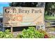 G.T. Bray Park sign amidst lush greenery, promoting outdoor recreation and community activities at 409 Bryn Mawr Is, Bradenton, FL 34207