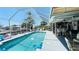 Inviting screened-in pool area with clear blue water and comfortable seating for outdoor relaxation and entertaining at 409 Bryn Mawr Is, Bradenton, FL 34207