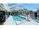 Screened-in pool area with lounge seating, perfect for outdoor relaxation and entertainment at 409 Bryn Mawr Is, Bradenton, FL 34207