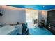 Indoor work out room has a hot tub, gym equipment and view of pool at 409 Bryn Mawr Is, Bradenton, FL 34207