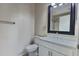 Cozy bathroom featuring a white vanity, framed mirror, and neutral wall color at 4142 Central Sarasota Pkwy # 1423, Sarasota, FL 34238