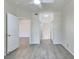 Bright and airy bedroom with plank flooring, an overhead light fixture, and large closet at 4142 Central Sarasota Pkwy # 1423, Sarasota, FL 34238