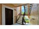 Condo entrance featuring a private stairway and a sturdy, secure front door with a peep-hole at 4142 Central Sarasota Pkwy # 1423, Sarasota, FL 34238