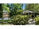 Relaxing outdoor patio area with lake views and picnic table at 4142 Central Sarasota Pkwy # 1423, Sarasota, FL 34238
