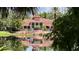 Beautiful clubhouse overlooking a serene pond with fountain at 4142 Central Sarasota Pkwy # 1423, Sarasota, FL 34238
