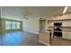 Spacious living room and kitchen with open layout, modern appliances, and ample natural light at 4142 Central Sarasota Pkwy # 1423, Sarasota, FL 34238