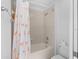 Cozy bathroom showcasing a tub with tiled walls and a charming flamingo shower curtain at 4429 67Th E St, Bradenton, FL 34203
