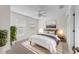 Cozy bedroom with bed, natural light from windows with blinds, fan and stylish décor at 4429 67Th E St, Bradenton, FL 34203