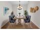 Bright dining room featuring decorative chandelier and a unique driftwood dining table at 4429 67Th E St, Bradenton, FL 34203