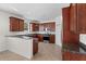 Kitchen featuring granite countertops, stainless appliances, tile floor, and cherry wood cabinets at 4429 67Th E St, Bradenton, FL 34203