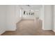Open-concept living room with tile flooring, arched doorways, and abundant natural light at 4429 67Th E St, Bradenton, FL 34203