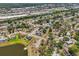 Community aerial view near a lake, offering easy access to a playground, tennis courts, and a shopping center at 4468 Maraldo Ave, North Port, FL 34287