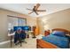 Bedroom featuring neutral walls, a bed, desk, and tiled floors at 4468 Maraldo Ave, North Port, FL 34287