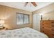 Comfortable bedroom with a large window, closet, and dresser at 4468 Maraldo Ave, North Port, FL 34287