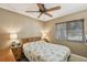 Cozy bedroom with a ceiling fan and a window providing natural light at 4468 Maraldo Ave, North Port, FL 34287
