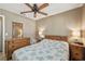 Bedroom featuring two dressers, ceiling fan, and a plush bed at 4468 Maraldo Ave, North Port, FL 34287