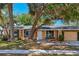 Charming single-story home featuring a well-maintained lawn, large shade trees, and neutral-toned exterior at 4468 Maraldo Ave, North Port, FL 34287