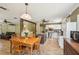 Bright open-concept kitchen with an island, stainless steel appliances and dining table at 4468 Maraldo Ave, North Port, FL 34287